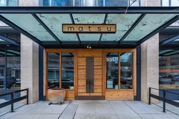 the front of the mastu building in the city